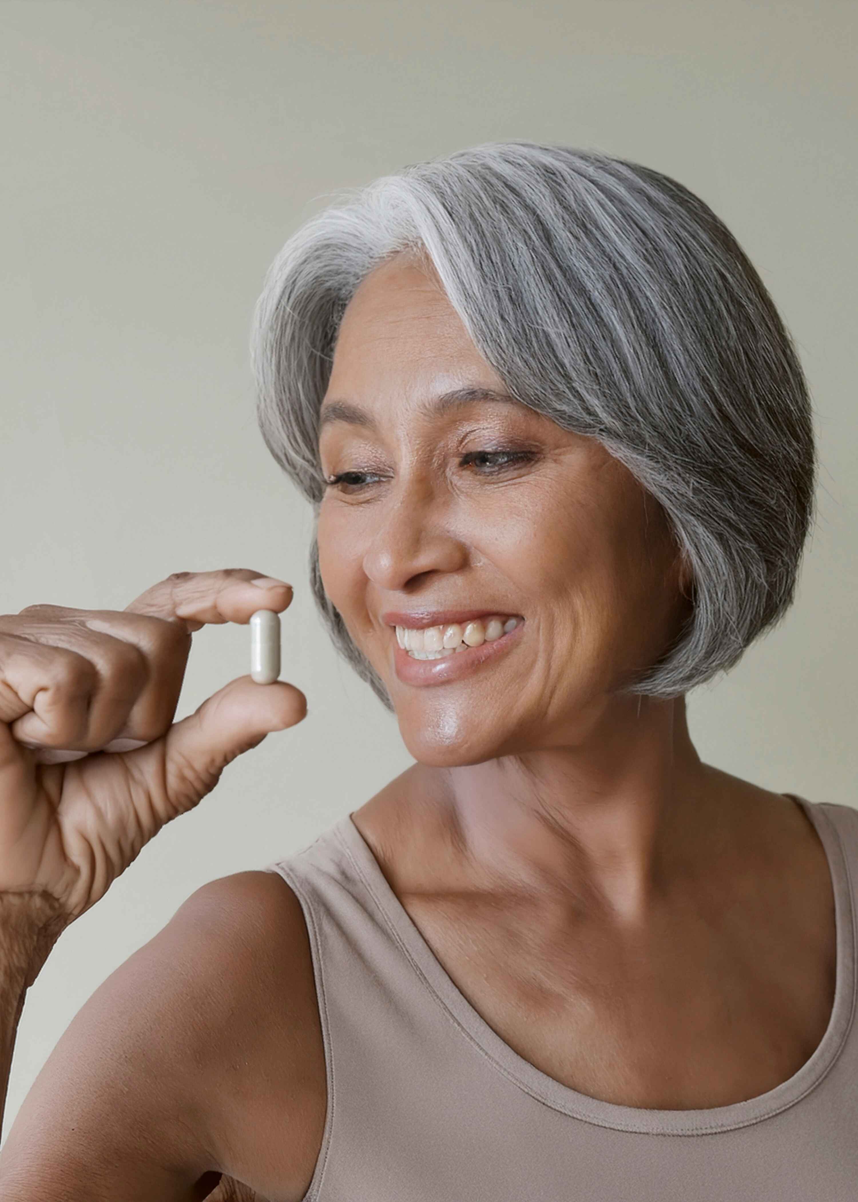 Woman 40+ using NewEra supplement at home